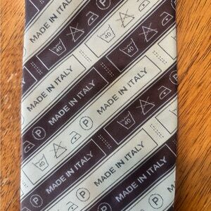 Moschino Diagonal Stripe Logo Tie Beige  Brown Fabric Care Tag Pattern. UNIQUE